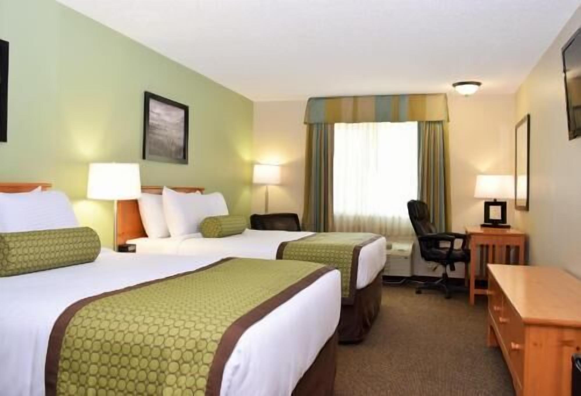 Premium bedding, pillowtop beds, desk, laptop workspace