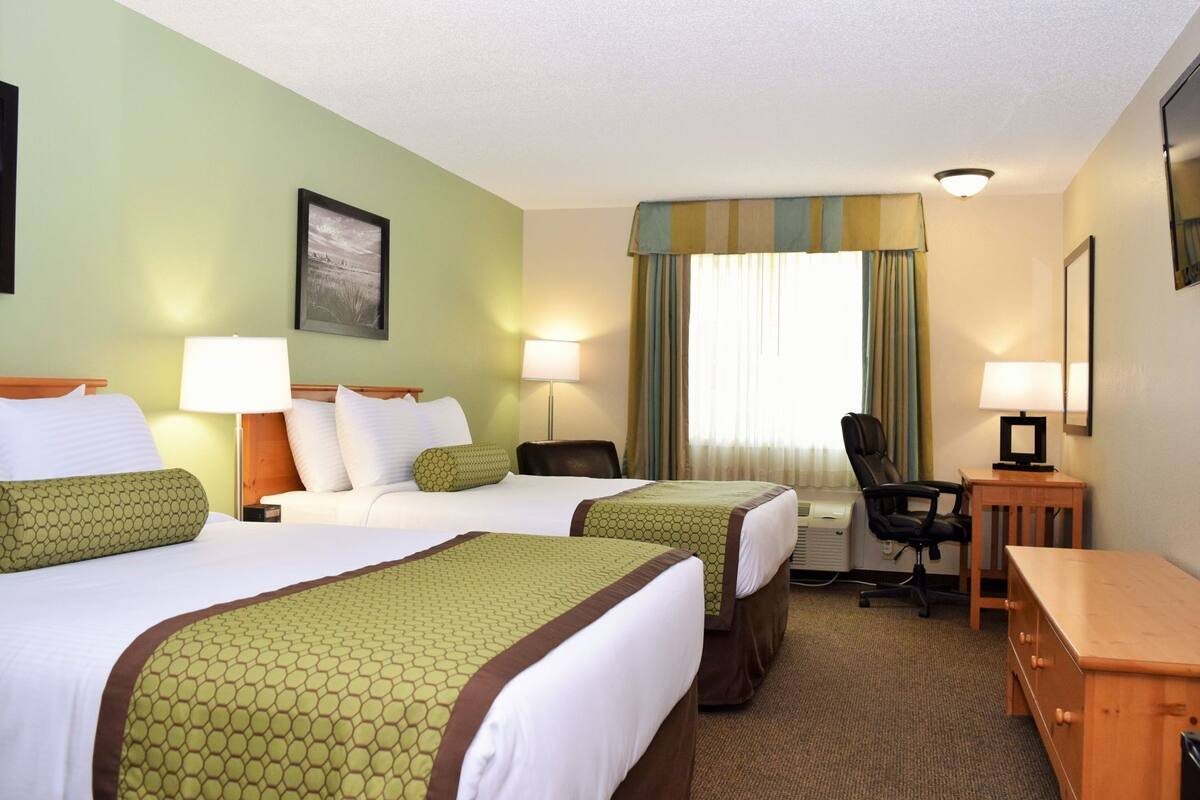 Premium bedding, pillowtop beds, desk, laptop workspace