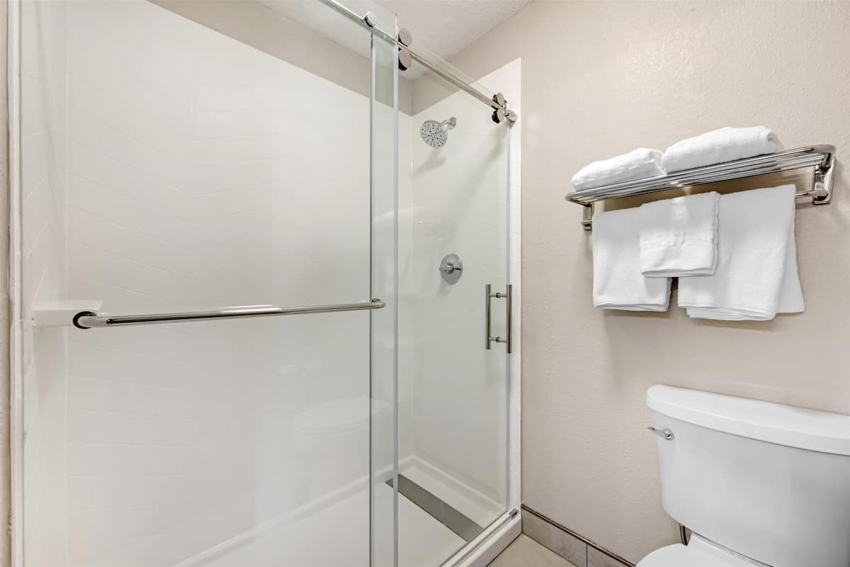 junior suite, 2 queen beds, non smoking, refrigerator & microwave (third bed is a sofabed) | bathroom | combined shower/bathtub, free toiletries, hair dryer, towels
