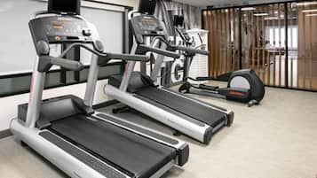 A fitness center with treadmills and a stationary bike.