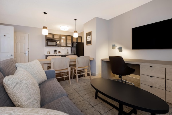 Desk, laptop workspace, blackout drapes, iron/ironing board