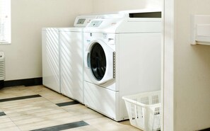 Convenient laundry facilities feature a front-loading washer and dryer.