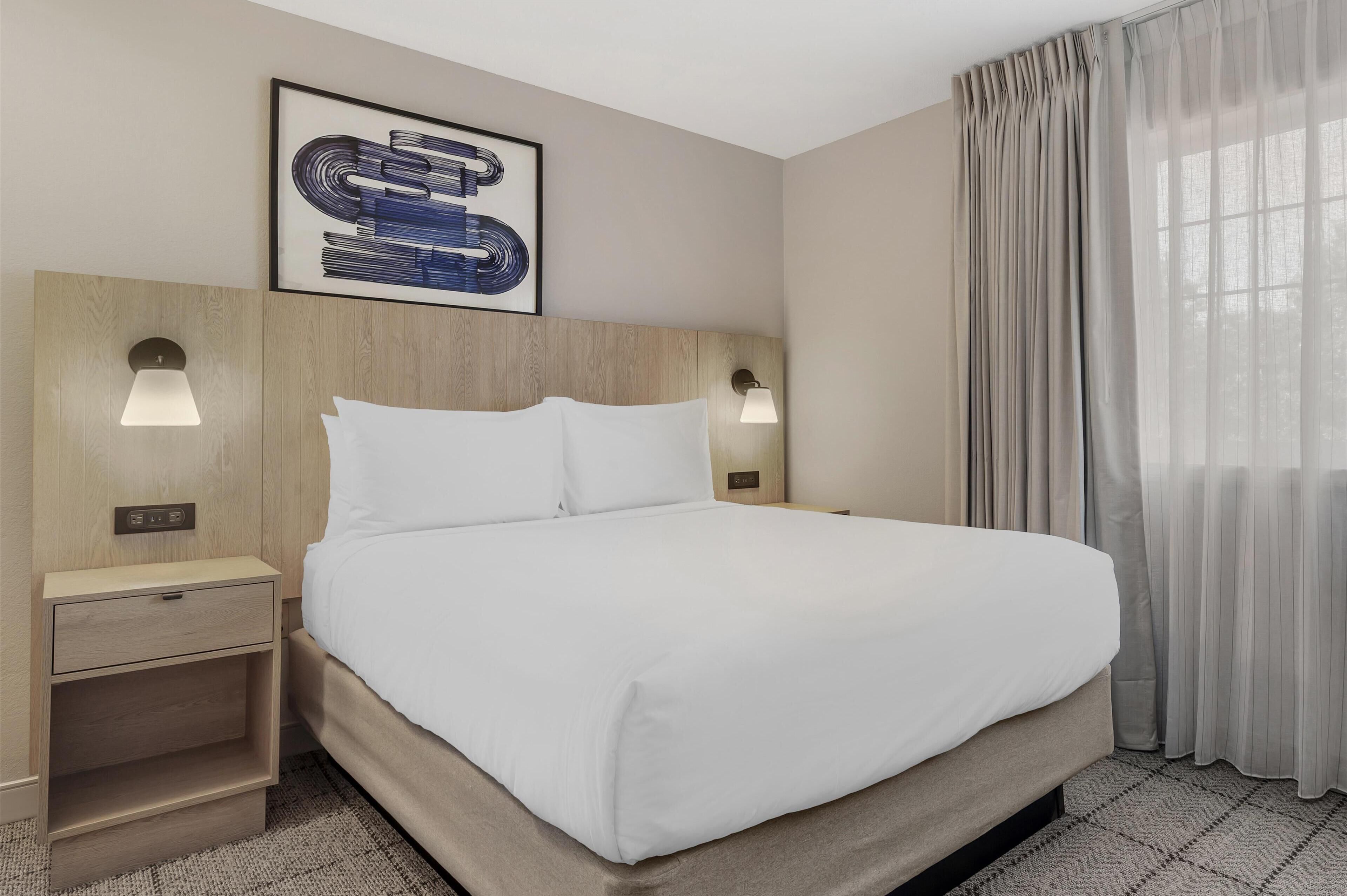 suite, 1 queen bed with sofa bed (one bedroom) | desk, laptop workspace, blackout curtains, iron/ironing board