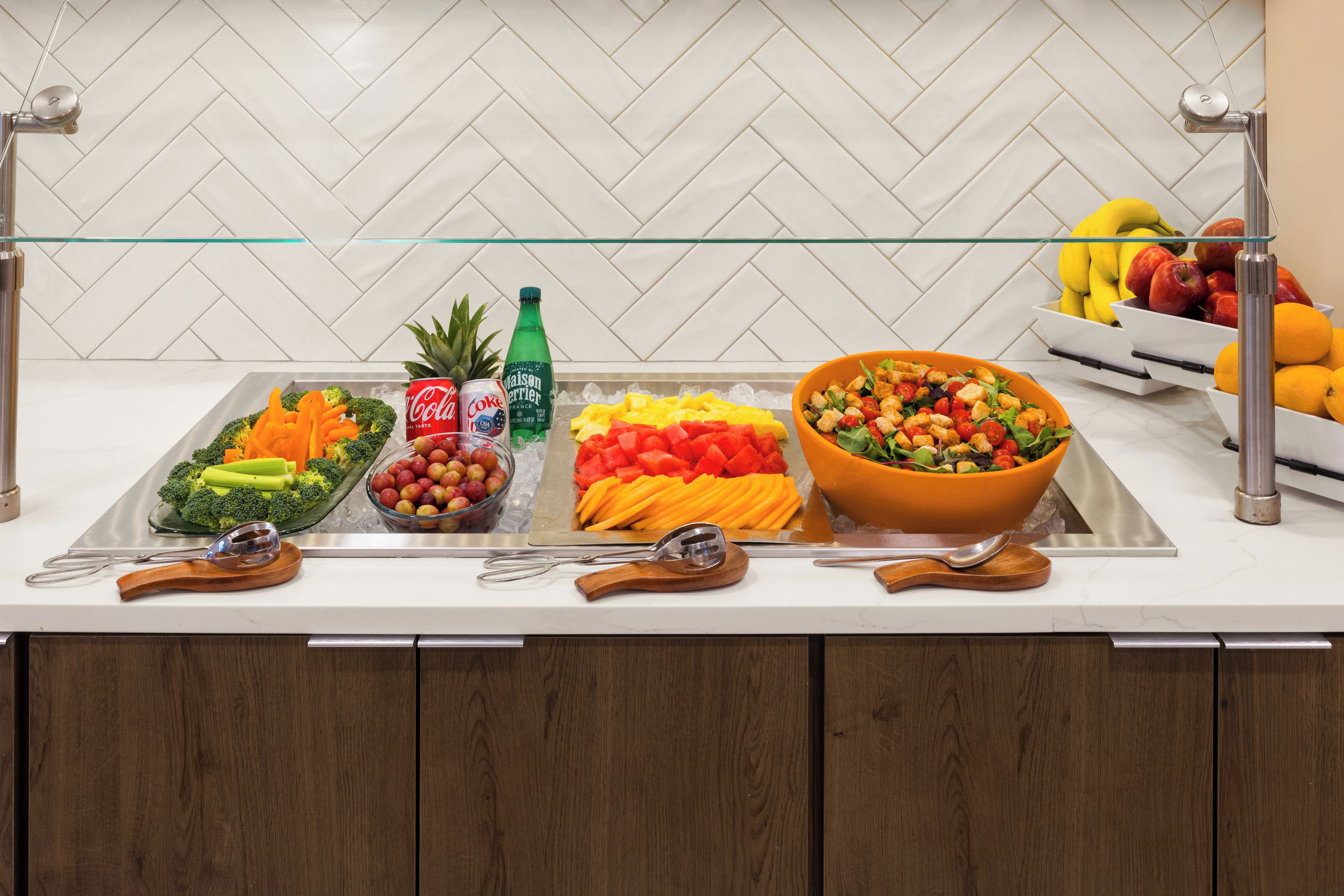 A buffet setup with various food items and beverages.