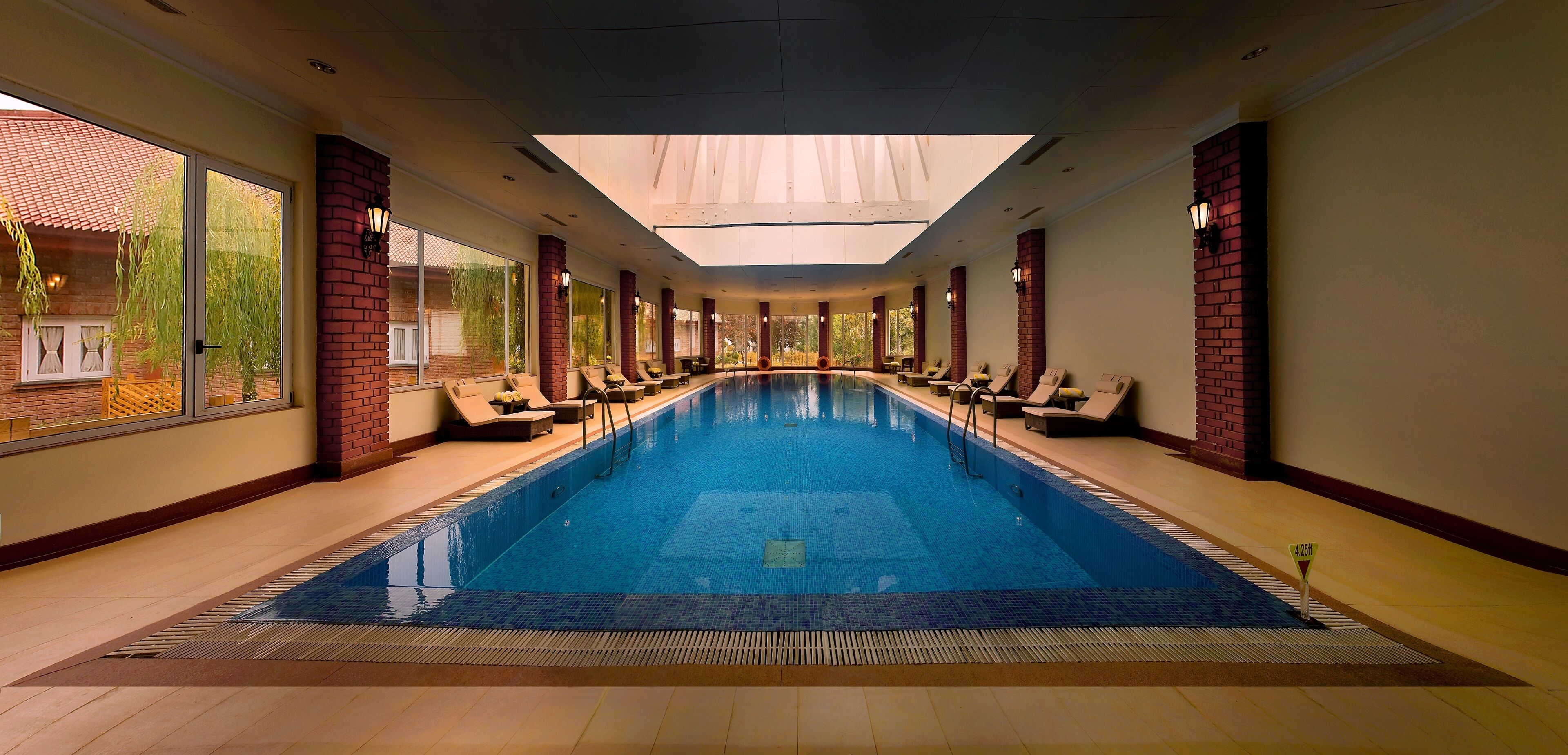 Indoor pool, open 7:00 AM to 7:00 PM, pool umbrellas