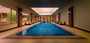 Indoor pool, open 7:00 AM to 7:00 PM, pool umbrellas - The Lalit Grand Palace Srinagar (Srinagar)