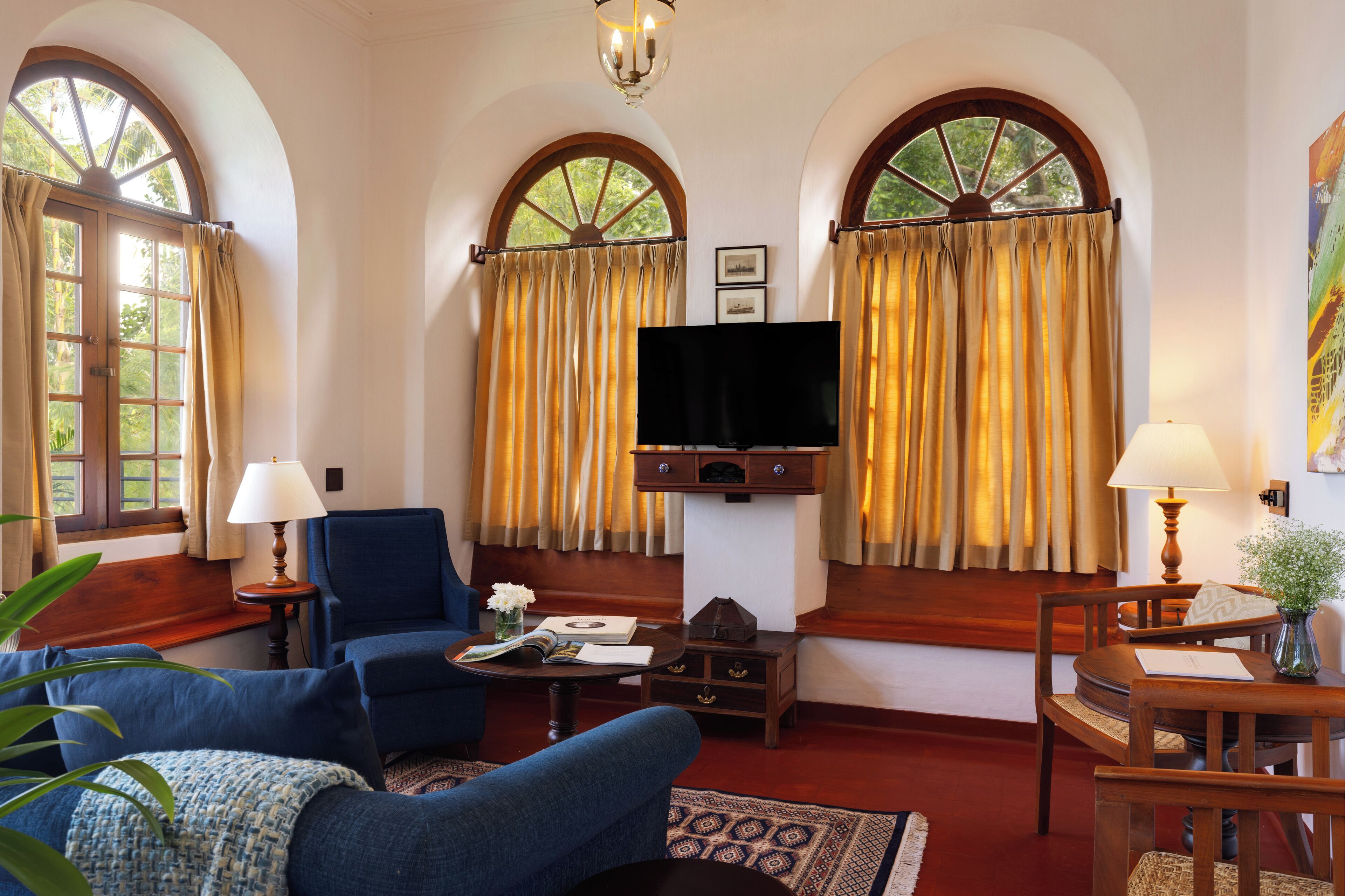 deluxe sea facing suite with balcony | living area | 32-inch led tv with satellite channels, tv