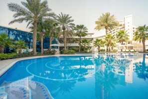 Indoor pool, 3 outdoor pools, pool umbrellas, sun loungers - The Diplomat Radisson BLU Hotel, Residence & Spa (Manama)
