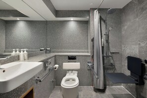 A modern bathroom with a shower, toilet, and sink. - Edinburgh Marriott Hotel Holyrood (Edinburgh)