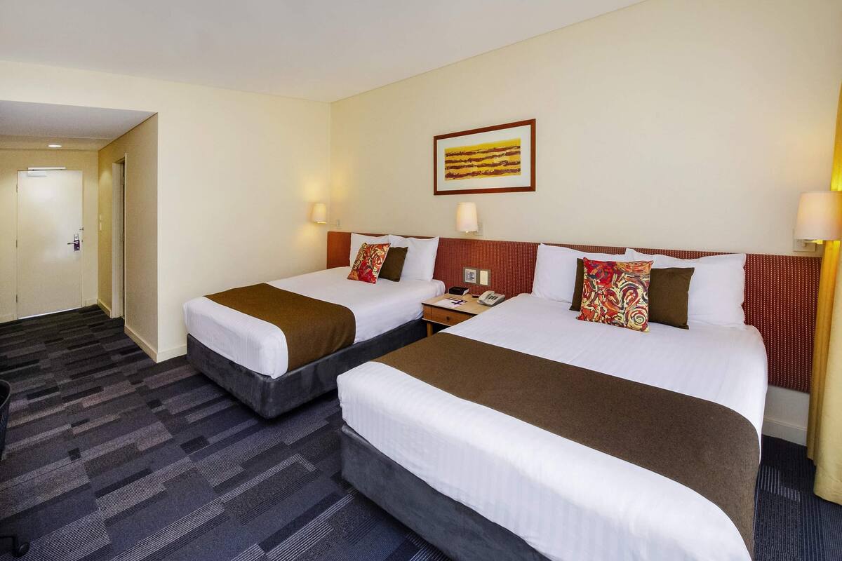 Deluxe Room, 2 Queen Beds, Garden View | Minibar, in-room safe, desk, iron/ironing board