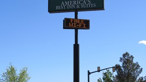 A sign for 'America's Best Inn & Suites' with a digital display below stating 'FREE WIFI'. - America's Best Inn & Suites St. George (St. George)