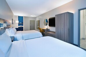 A hotel room with two beds, a desk, a chair, a wardrobe, and a TV. - Holiday Inn Express & Suites Wauseon by IHG (Wauseon)