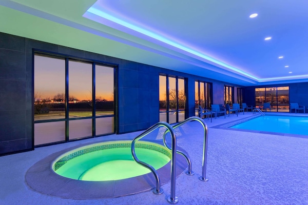 Indoor pool, open 8:00 AM to 10:00 PM, pool loungers