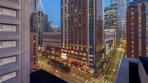 A high-rise building with multiple floors, large windows, and a modern architectural design. - Grand Hyatt Seattle (Seattle)