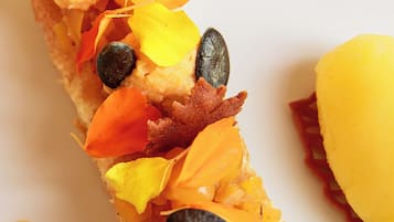 A close-up of a food item with various toppings.