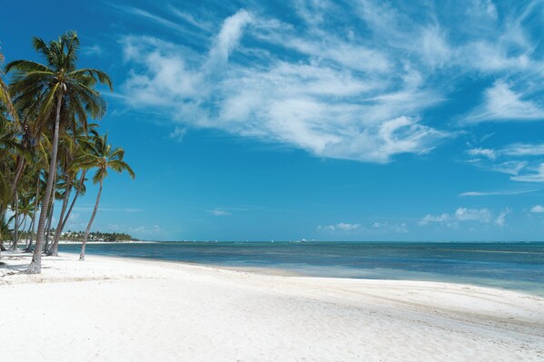 Private beach, white sand, sun-loungers, beach umbrellas