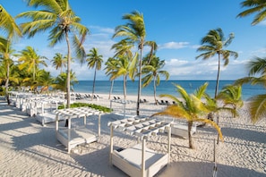 Private beach, white sand, sun loungers, beach umbrellas