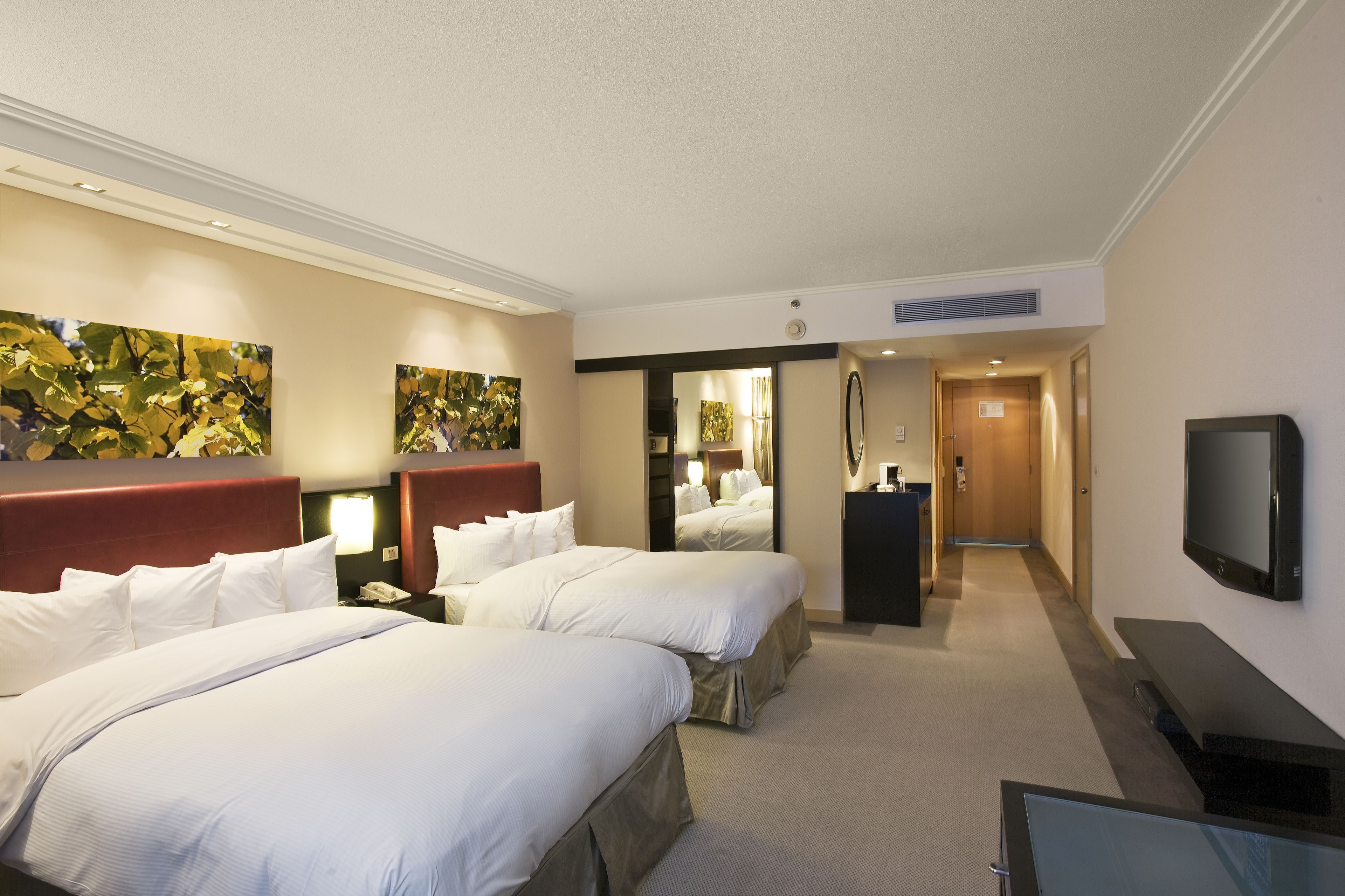 Premium bedding, down comforters, pillowtop beds, in-room safe