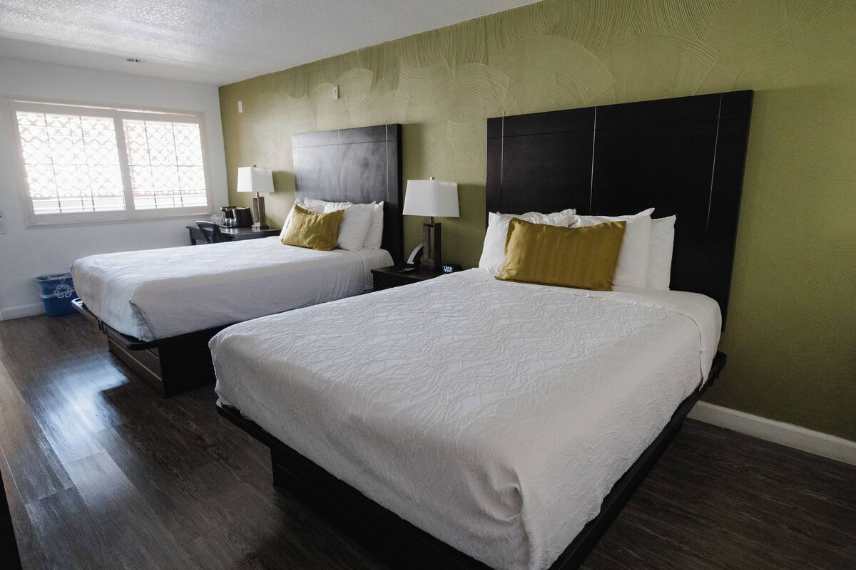 deluxe room, 2 queen beds, non smoking, refrigerator & microwave | in-room safe, iron/ironing board, free wifi, bed sheets