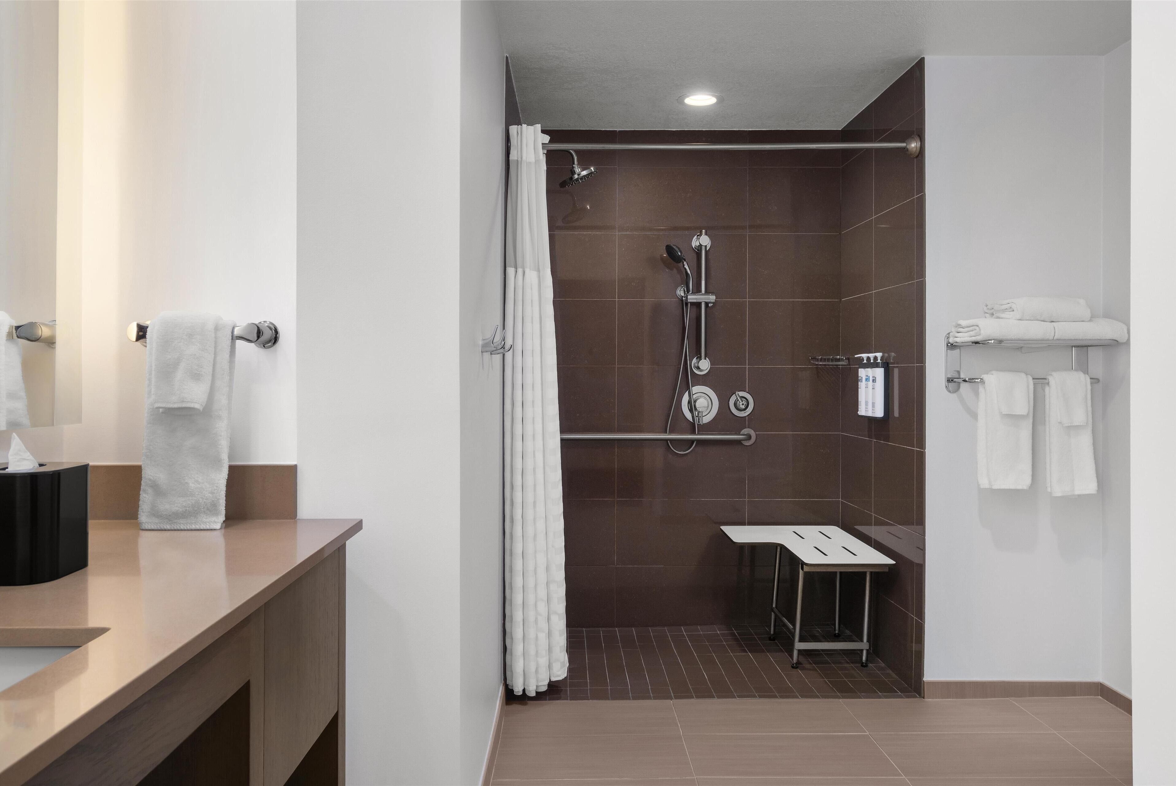 suite, 1 bedroom, accessible (shower) | bathroom | designer toiletries, hair dryer, towels