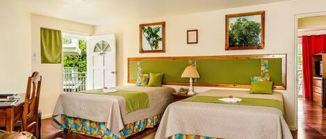 A hotel room with two beds, a dining area, and a view of the outdoors.