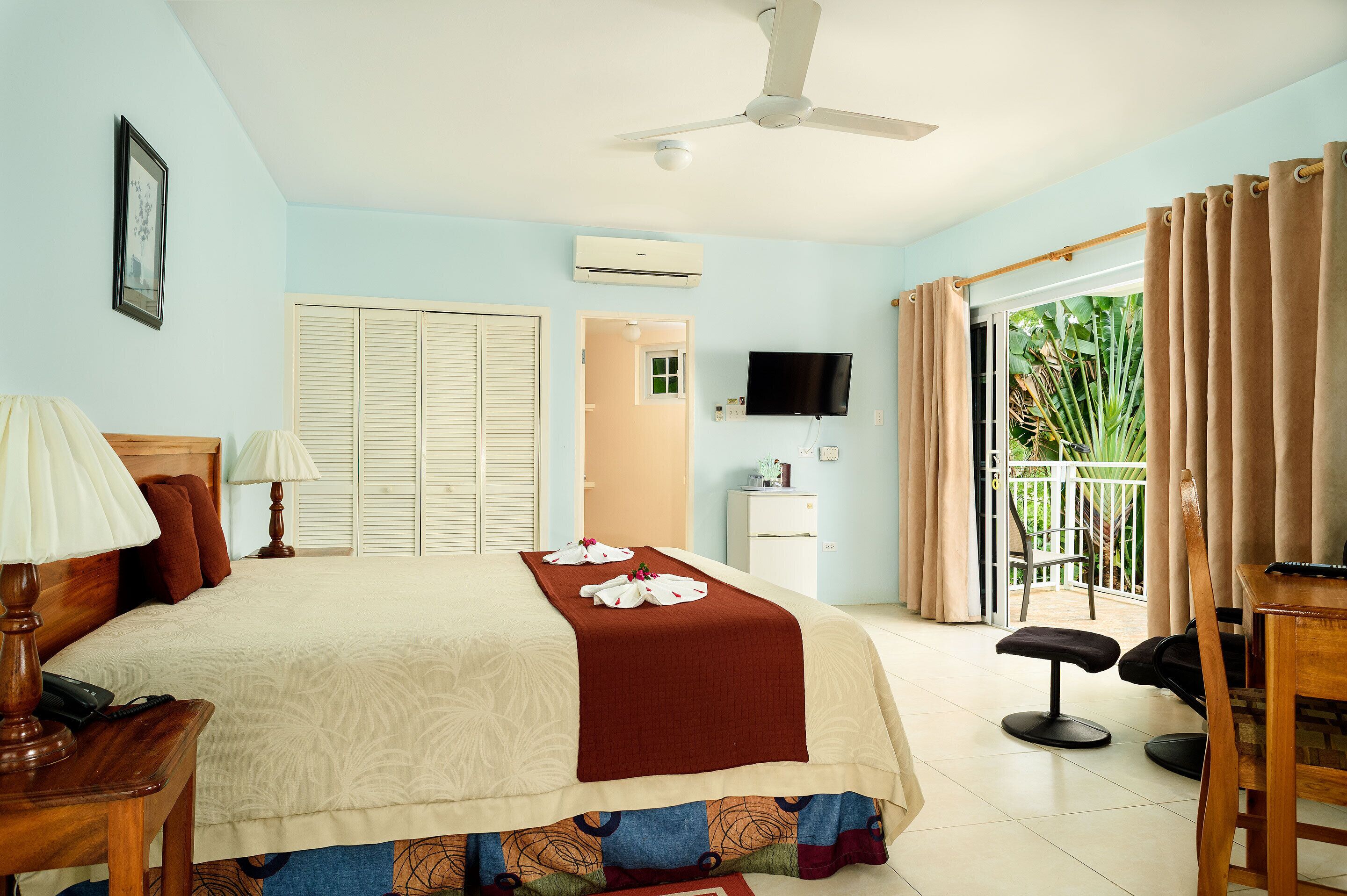 standard room, garden area (across the street from the beach) | in-room safe, individually decorated, blackout curtains