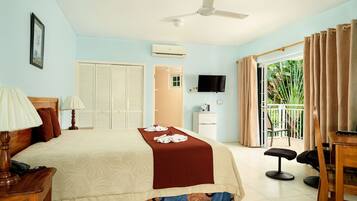Standard Room, Garden Area (Across the street from the beach) | In-room safe, individually decorated, blackout drapes