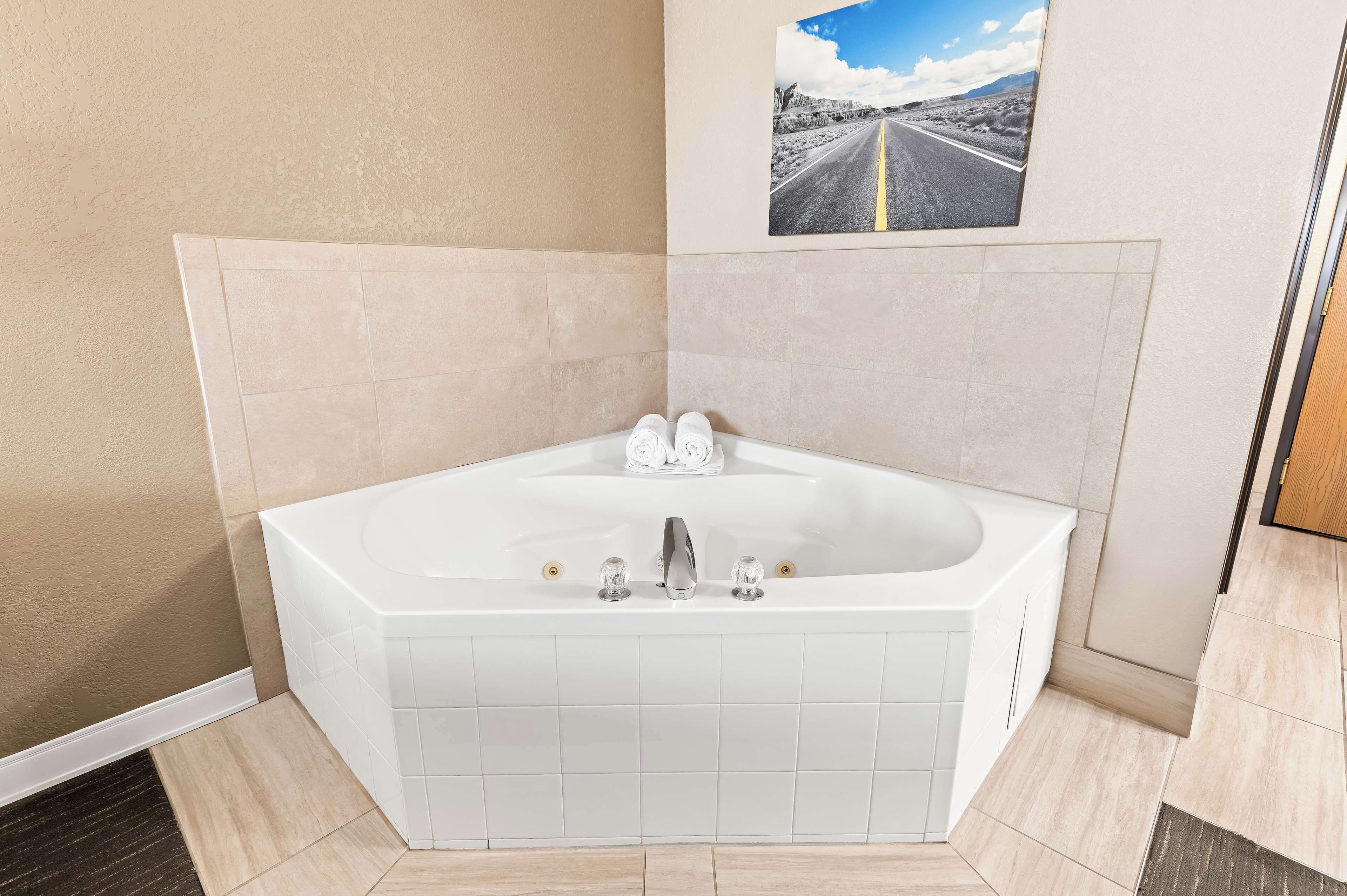 suite, 1 king bed with sofa bed, non smoking, jetted tub (with sofabed) | desk, laptop workspace, blackout curtains, iron/ironing board