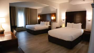 Premium bedding, desk, laptop workspace, blackout drapes