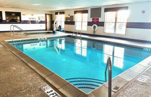 Indoor pool, open 7 AM to 11 PM, sun loungers