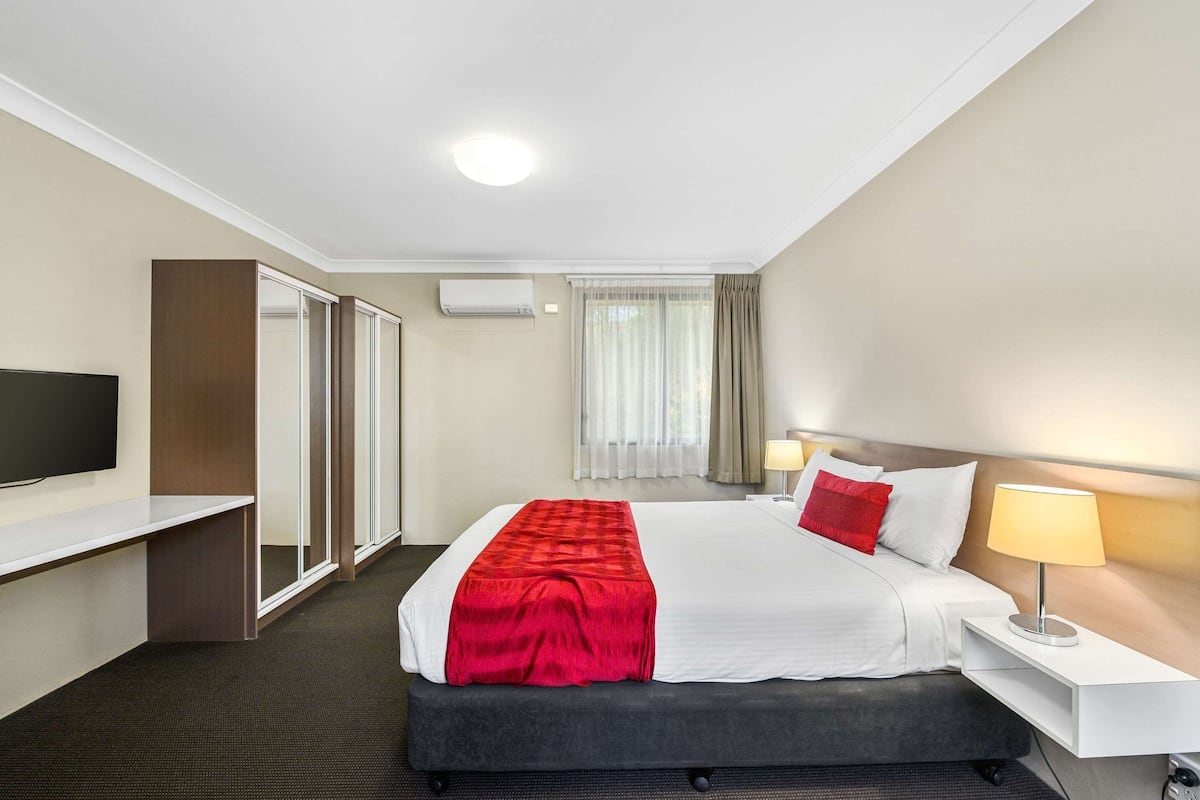 Desk, laptop workspace, blackout drapes, soundproofing