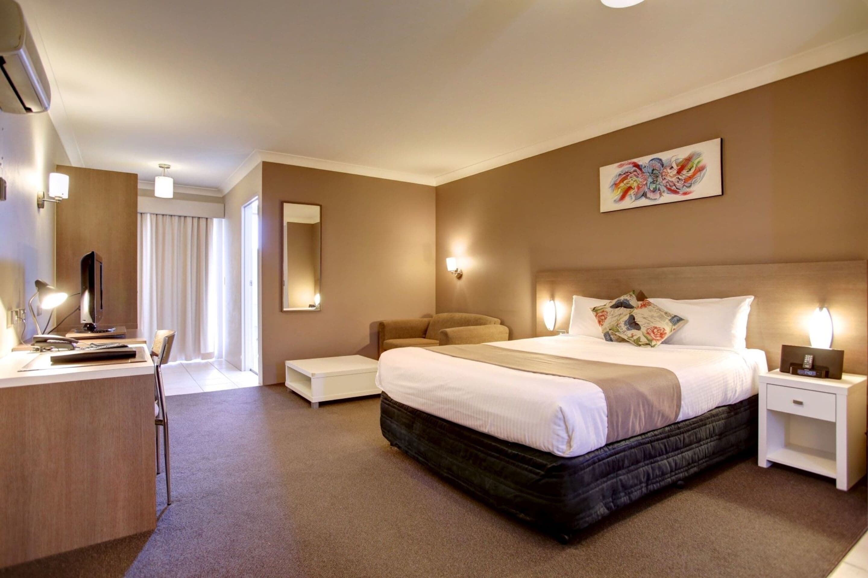 deluxe queen room | desk, laptop workspace, blackout curtains, soundproofing