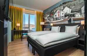 Luxe beddengoed, pillowtop-bedden, een minibar, een bureau