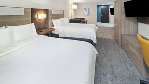 A hotel room with two beds, a desk, a chair, a flat-screen TV, and a door leading to another room. - Holiday Inn Express & Suites Pekin (Peoria Area) by IHG (Pekin)