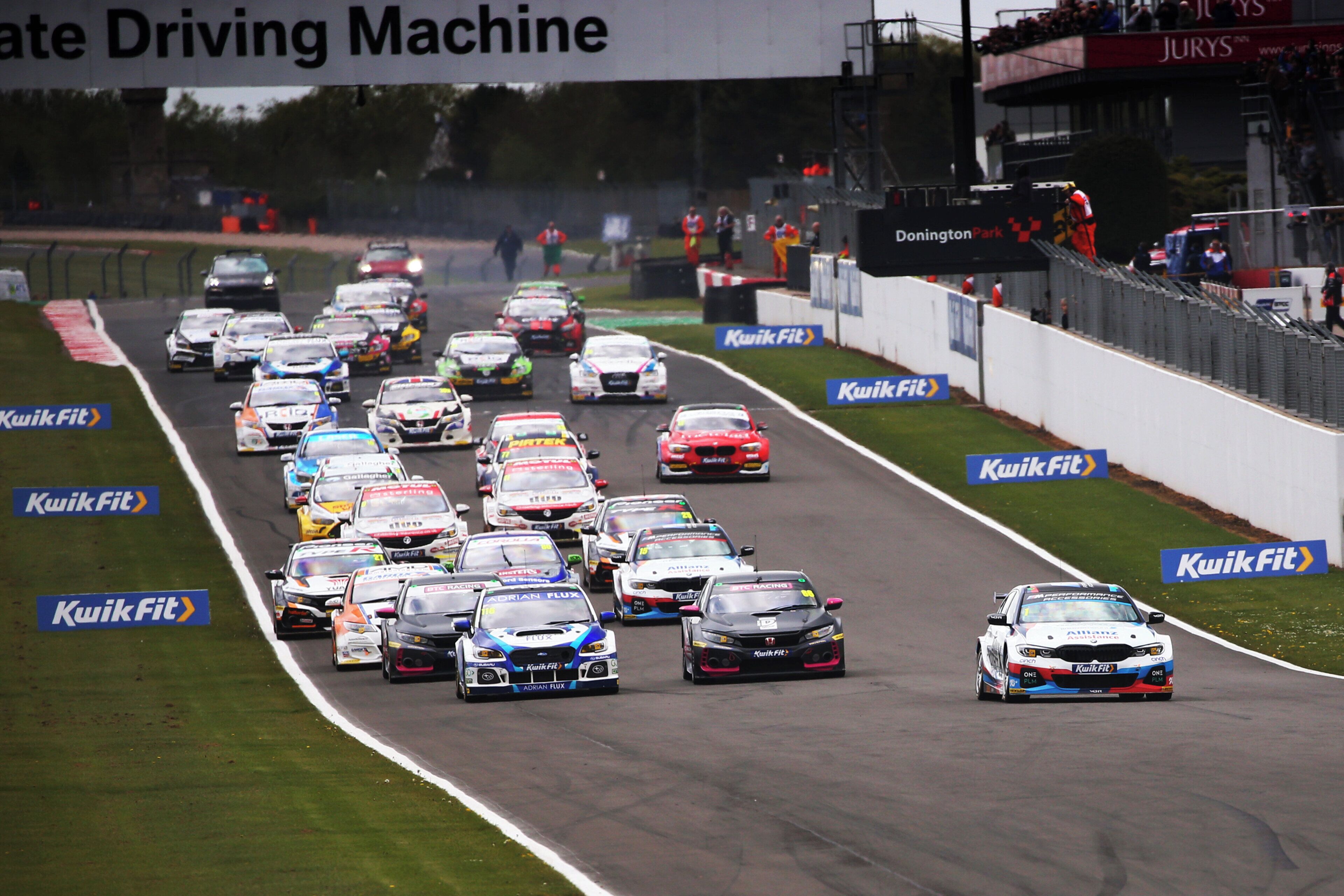 A racing event with multiple cars on a track.