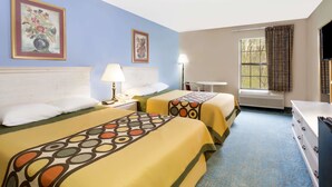 A hotel room with two beds, a desk, a chair, a window with curtains, and a flat-screen TV. - Super 8 by Wyndham Freeport (Freeport)