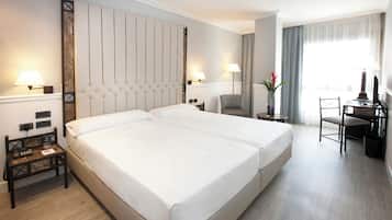 Luxe beddengoed, een minibar, een kluis op de kamer, een bureau