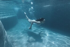 Seasonal outdoor pool, open 11:00 AM to 7:00 PM, pool umbrellas