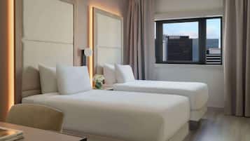Ropa de cama de alta calidad, edredón, camas con pillow-top y minibar
