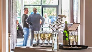 A table with champagne glasses and a bottle, viewed through a doorway. - Quality Hotel Vanersborg (Vanersborg)