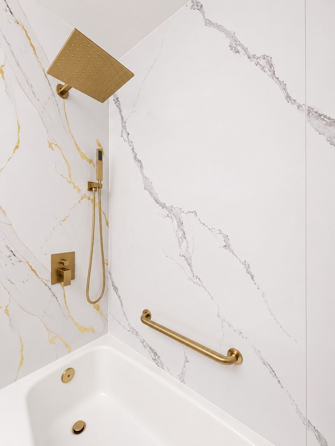 A bathroom with a bathtub, a showerhead, and a handheld shower attachment.