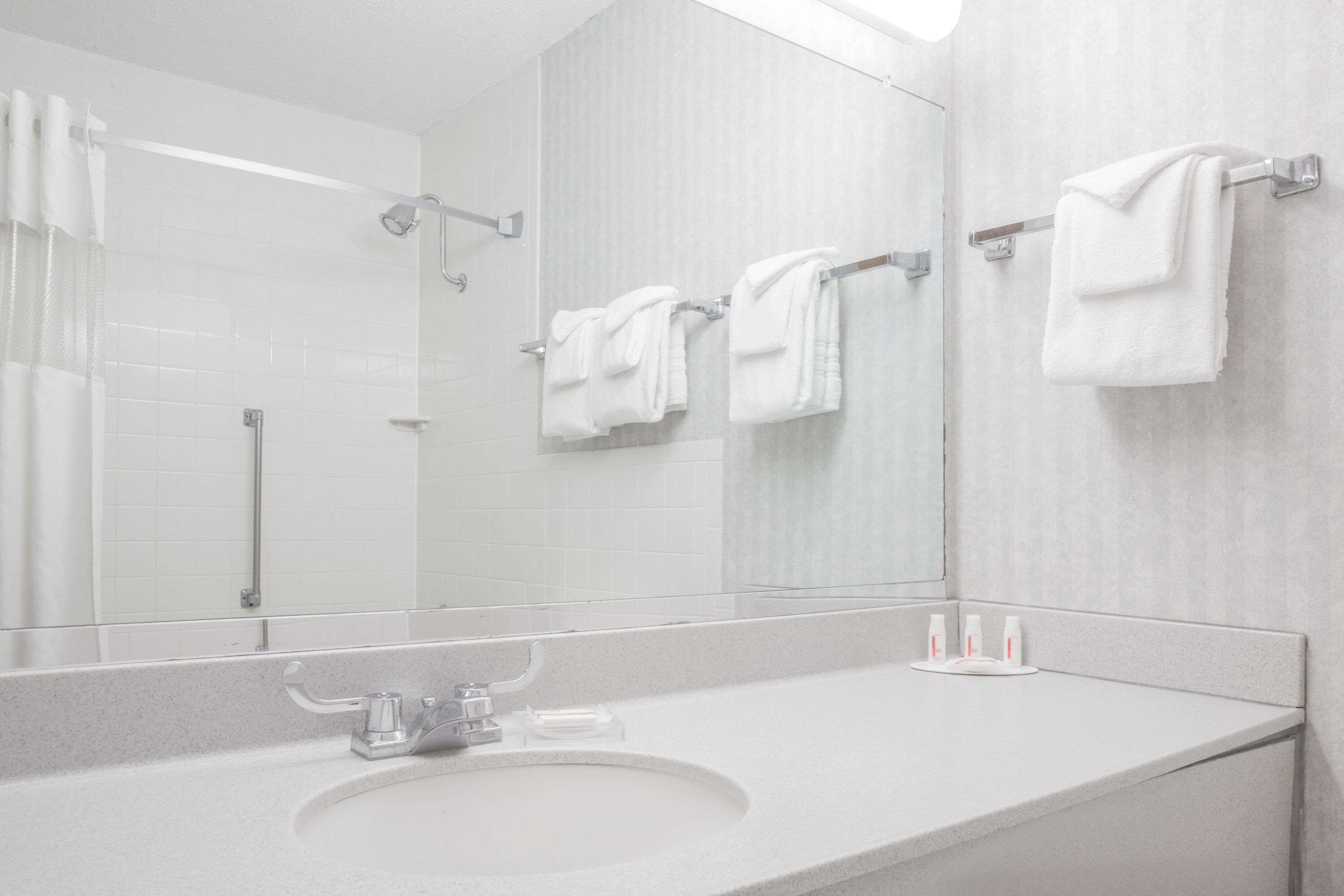 Designer toiletries, hair dryer, towels