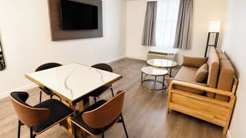 Suite, 1 King Bed with Sofa bed, Non Smoking | Living area | 32-inch TV with cable channels, pay films