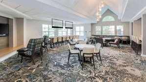 A spacious dining area with high ceilings, modern lighting, and a patterned carpet. - Residence Inn by Marriott Denver Golden/Red Rocks (Golden)