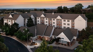 A multi-story hotel with a symmetrical facade, featuring a central entrance and multiple windows. - Residence Inn by Marriott Denver Golden/Red Rocks (Golden)