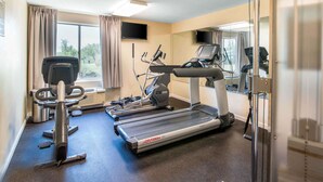 A gym with treadmills, a stationary bike, and a rowing machine. - Quality Inn Loudon-Concord (Loudon)