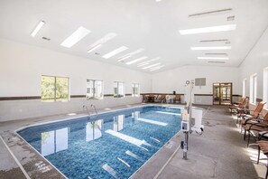 Indoor pool, open 7:00 AM to 10:00 PM, pool loungers