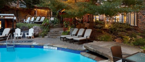 Outdoor pool, a heated pool, open noon to 8:00 PM, pool loungers