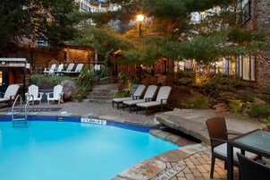 Outdoor pool, a heated pool, open noon to 8:00 PM, sun loungers