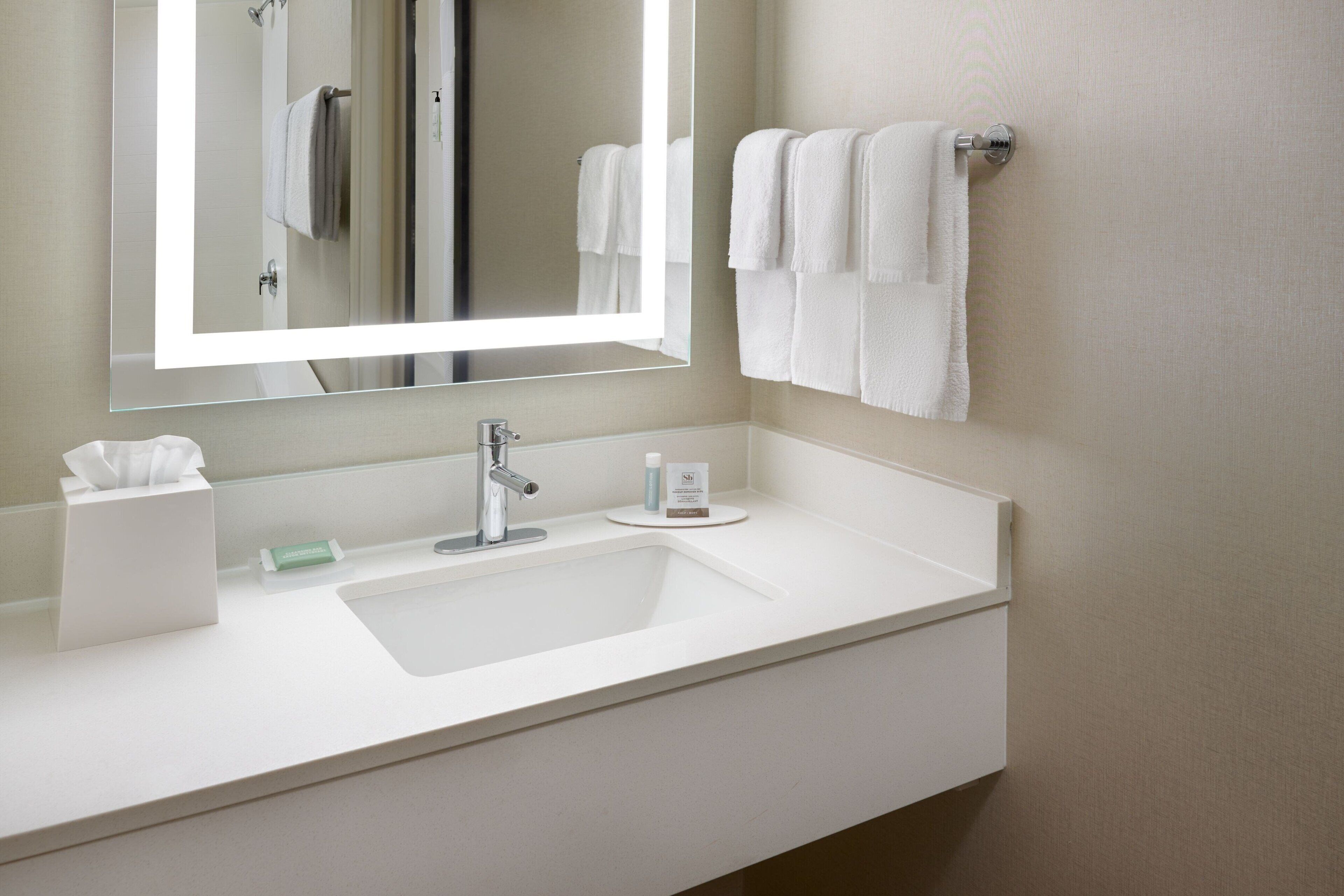 combined shower/bathtub, designer toiletries, hair dryer, towels